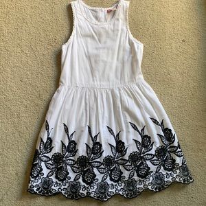 Super cute white summer dress with black cut out embroidery at the bottom